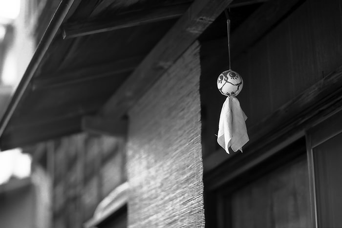 Doll hung under eaves