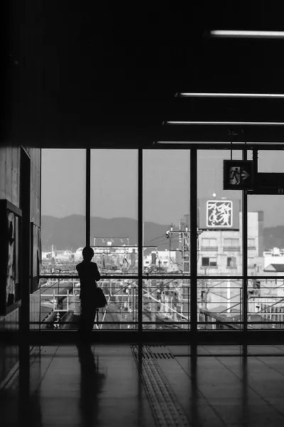 Man standing in front of glass wall