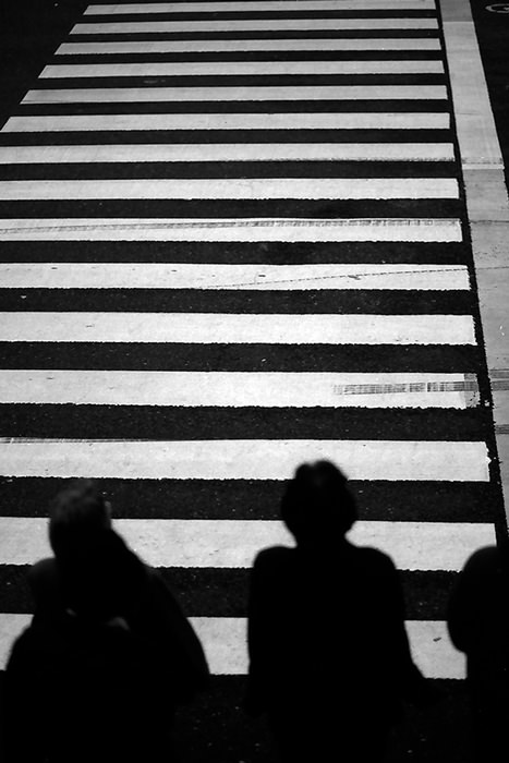 Figures waiting at stoplight