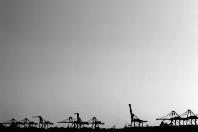 Silhouettes of gantry cranes