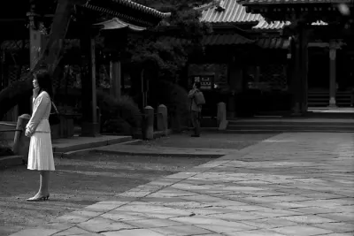 Woman standing on edge of approach way