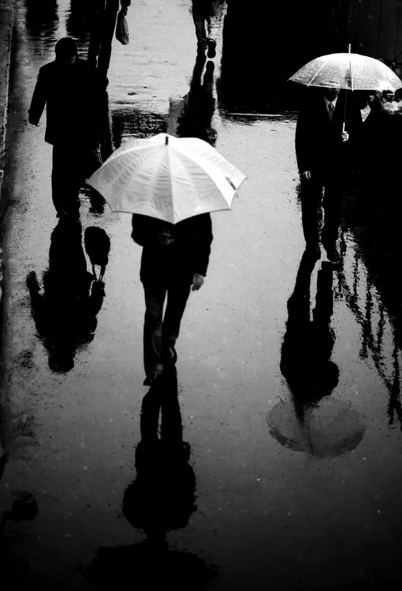 Pedestrians reflected on ground