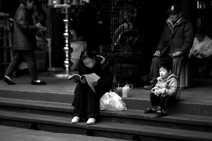 Woman and boy in precinct