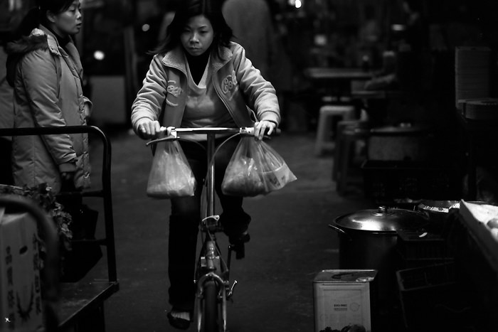 Woman pedaling bicycle