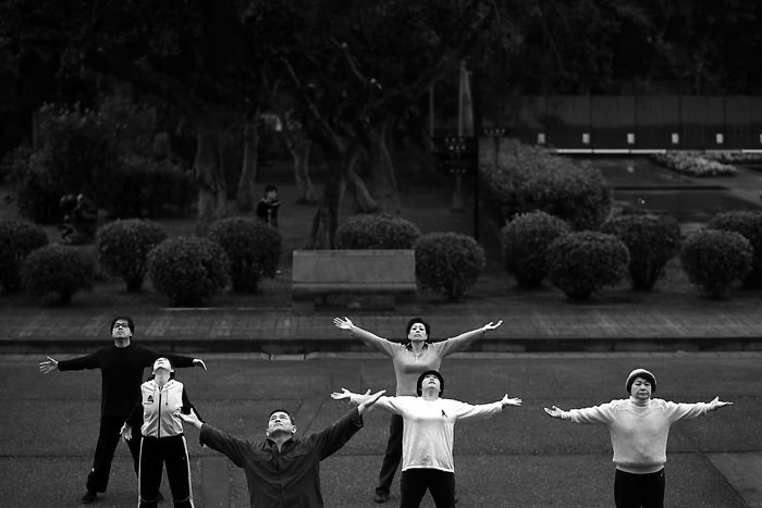People spreading arms