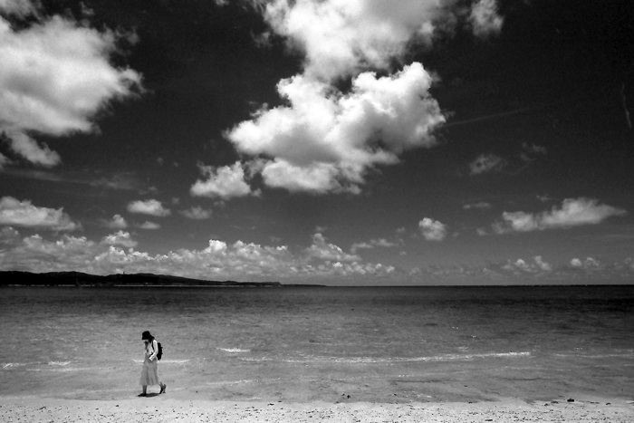 Woman walking shore