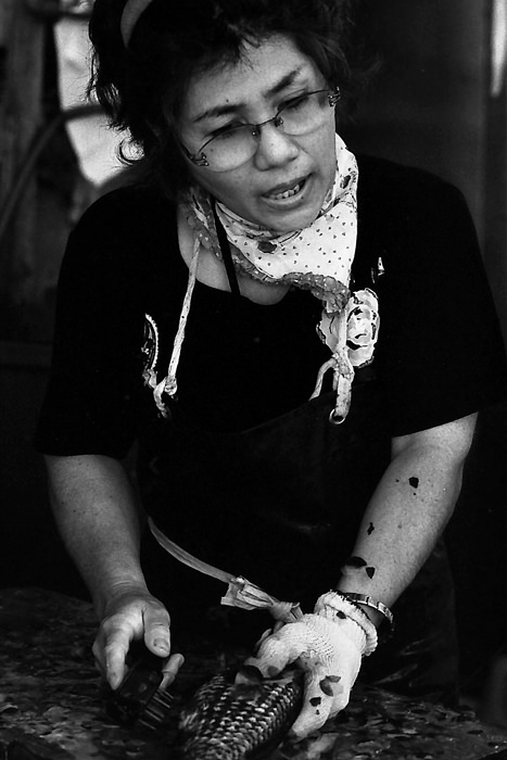 Woman scraping scales off
