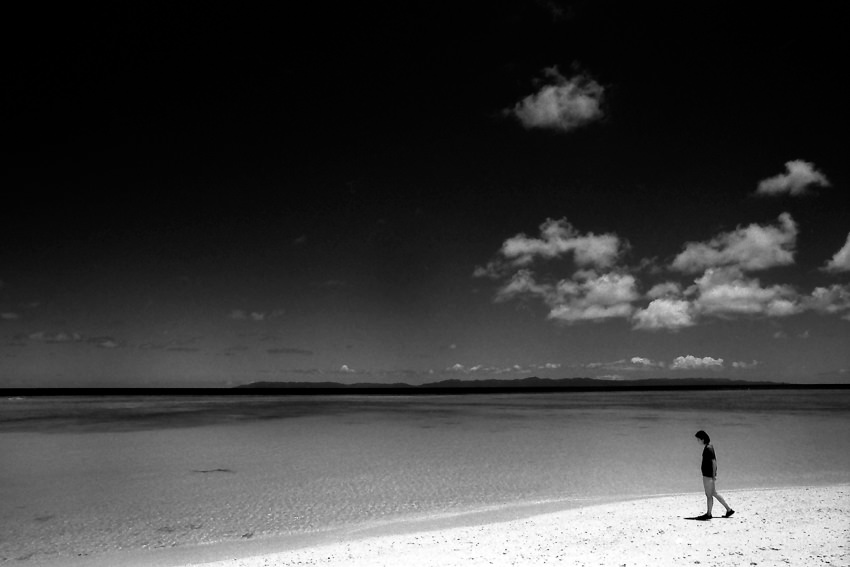 Woman walking beach