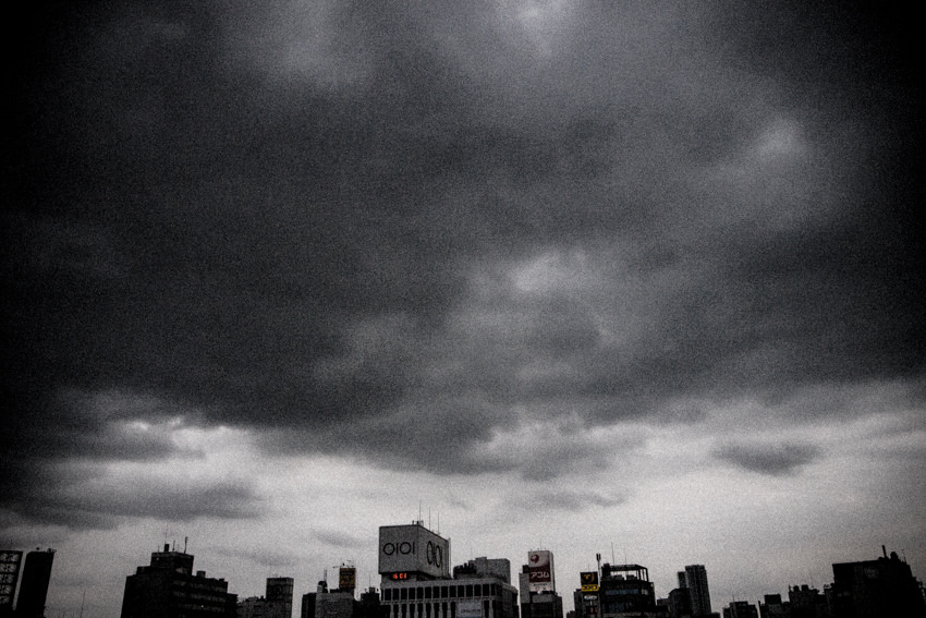 Buildings under dark clouds