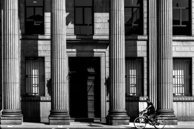 Bicycle in front of Corinthian columns