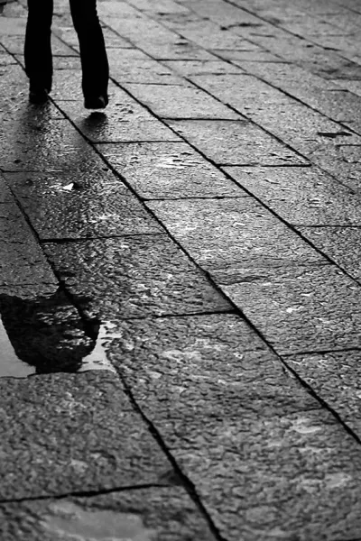 Figure in puddle