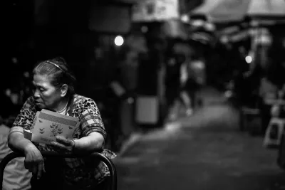 Woman walking dim passage