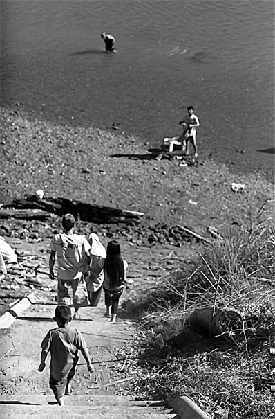 Boy Descending To Nam Khan River (Laos)