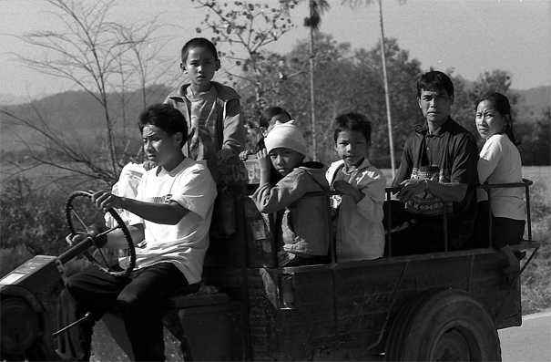 People On The Luggage Carrier Of The Tractor (Laos)