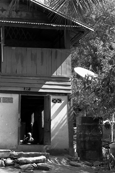 Older Woman Doing Needlework In The House (Laos)
