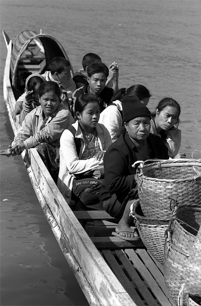 Passengers On The River Ferry (Laos)