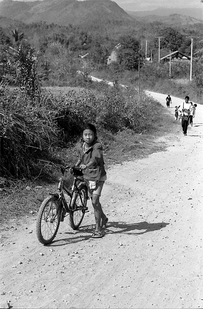 Girl Walking Her Bicycle (Laos)