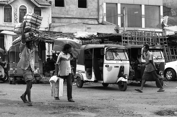 Men Walking The Street With Burdens (Sri Lanka)