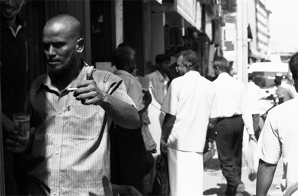 Man thumbing up in the busy street