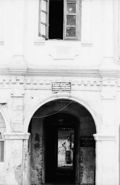 Man Stands Talking Inside Of The Building (Sri Lanka)