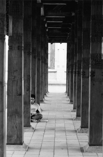 Young Man Sitting Among Columns (Sri Lanka)