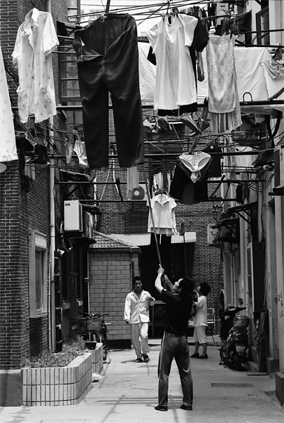 Laundies hung in the air in lane
