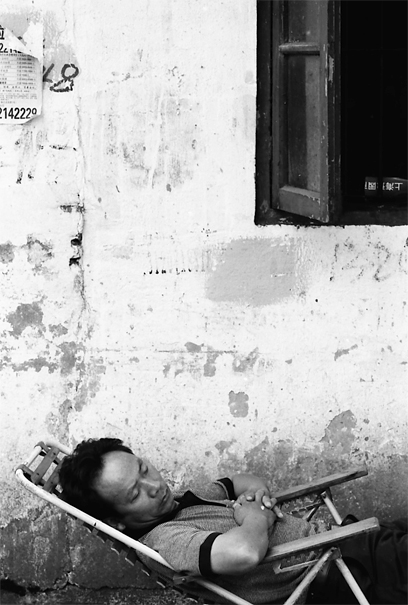 Man Napping In The Lane (China)
