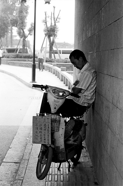 Man taking a nap under gate
