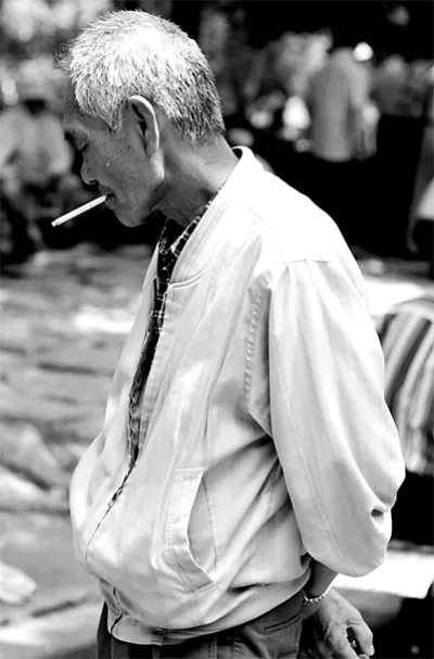 Man hanging around while smoking cigarette