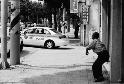 Man being surprised at police car
