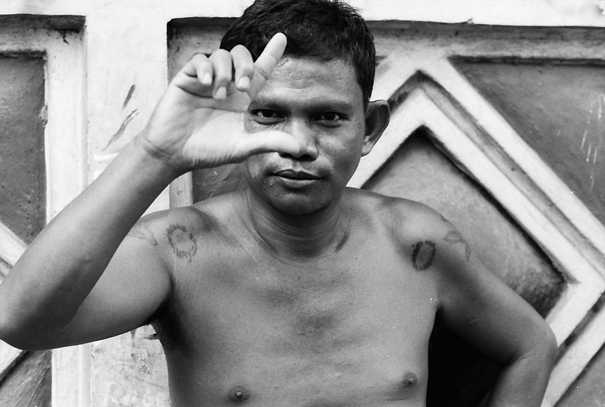 Man making L-shape with fingers