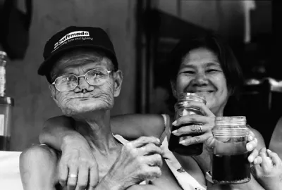 Man and woman drinking alcohol in daytime