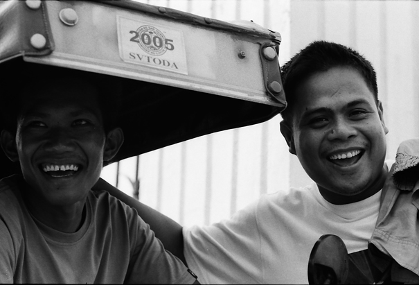Two Cheerful Men Beside A Tricycle (Philippines)