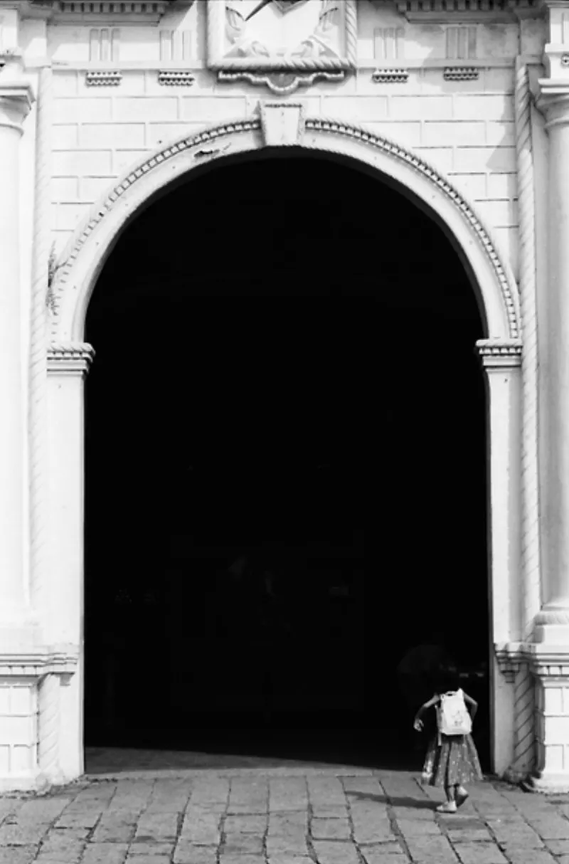 Girl entering into the cathedral
