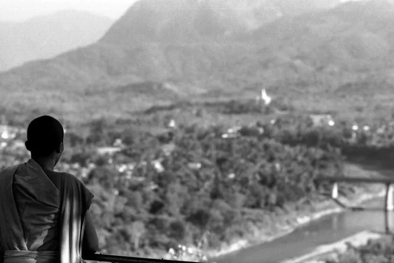 Young monk looking at panorama