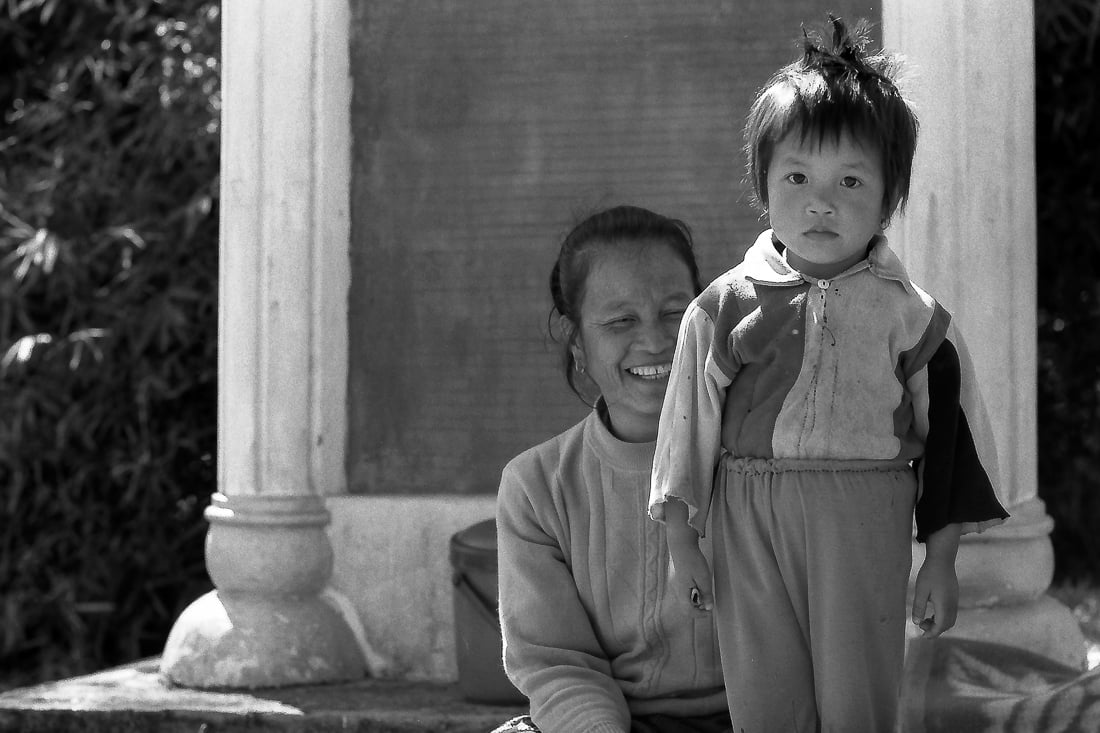 Older woman and boy relaxing in precinct
