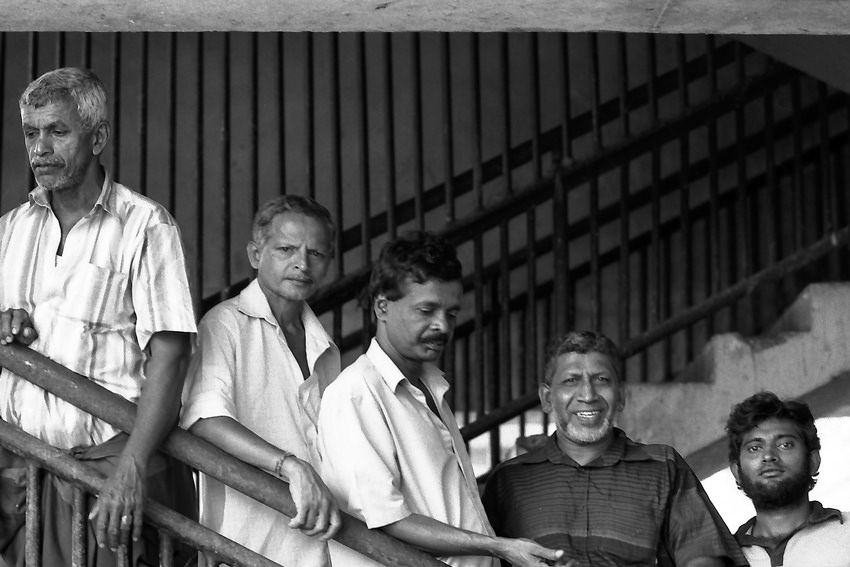 Men standing on stairway