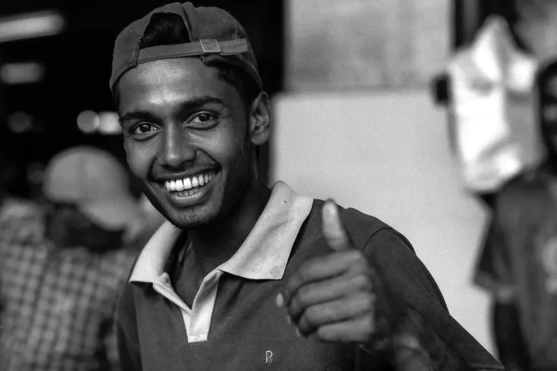 Man thumbing up in fish market