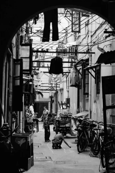 Two boys playing in dim lane