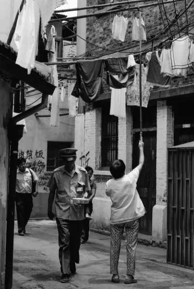 People walking under laundries