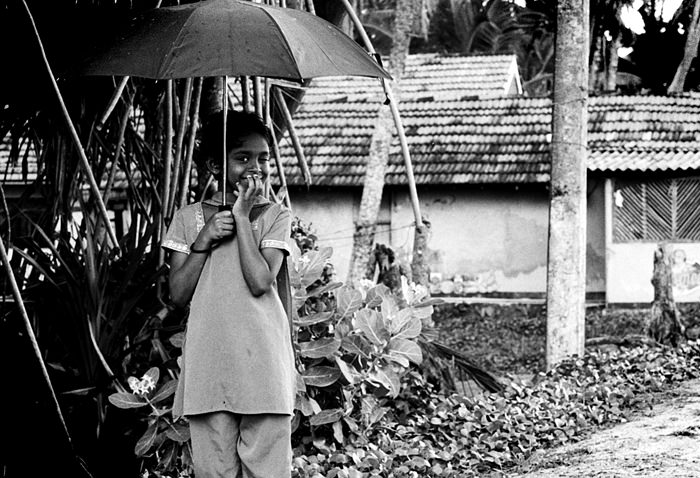 girl winking in rain