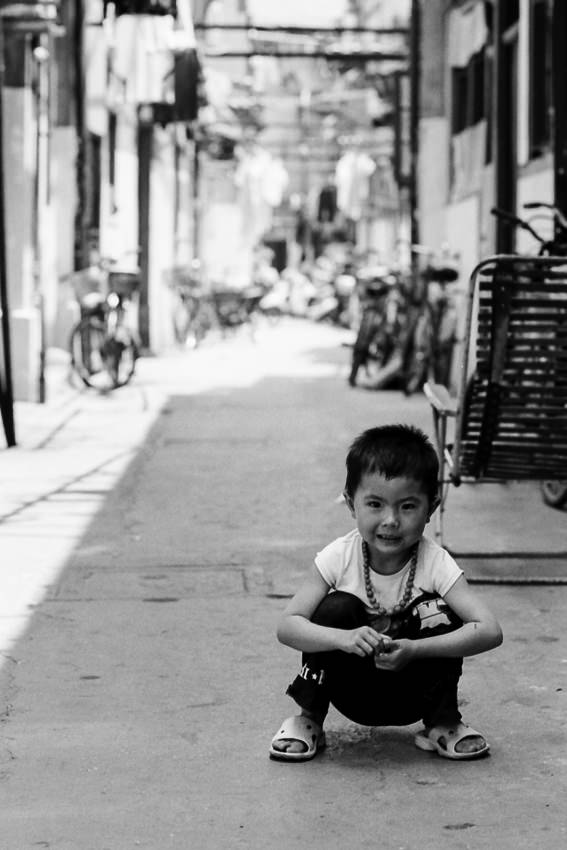Kid crouching down in lane
