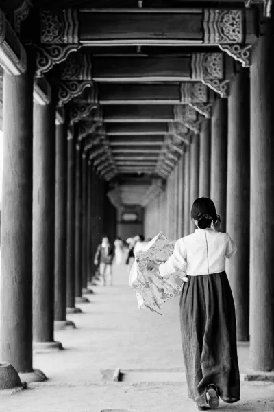 Woman with a Chima jeogori walking cloister
