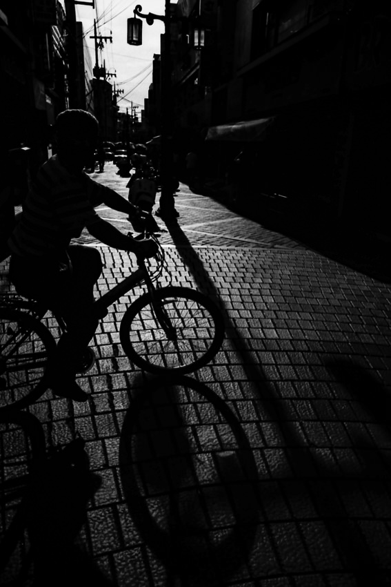 Silhouette of bicycle cutting across