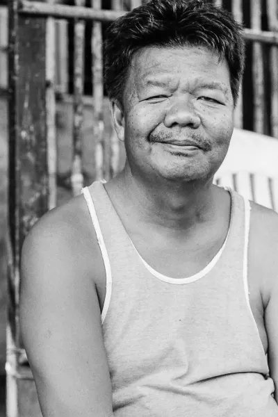 Man sitting by the roadside with doing nothing