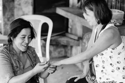 Woman getting her nails done by roadside