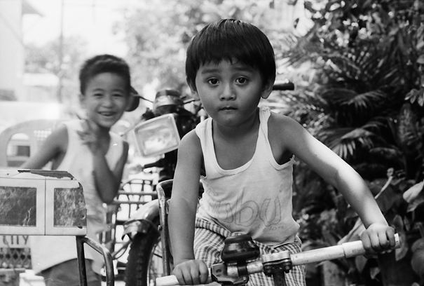 Boy Playing On The Bicycle (Philippines)