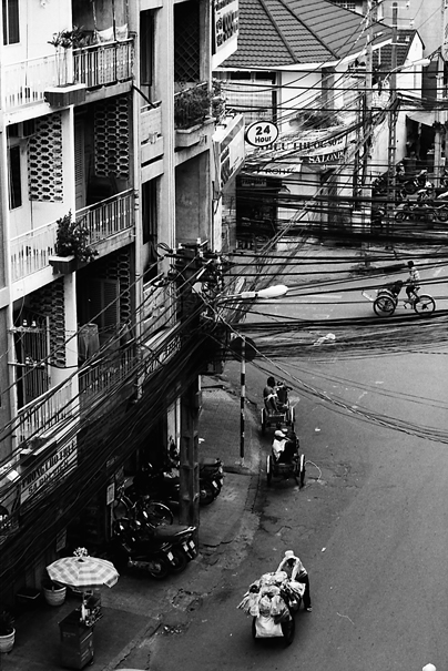 Cyclo And Peddlers On The Street (Vietnam)