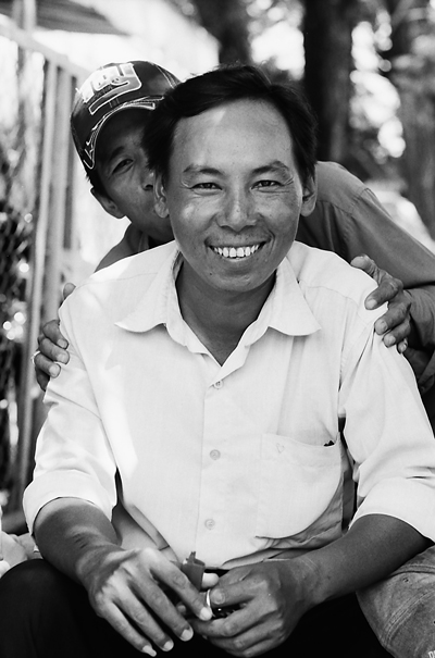 Smiling Man And His Mischievous Friend (Vietnam)