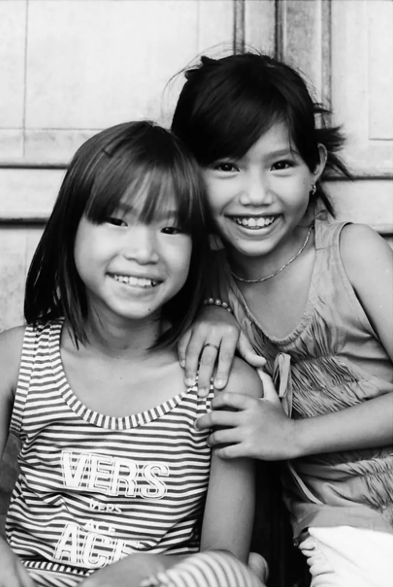 Two girls smiling together